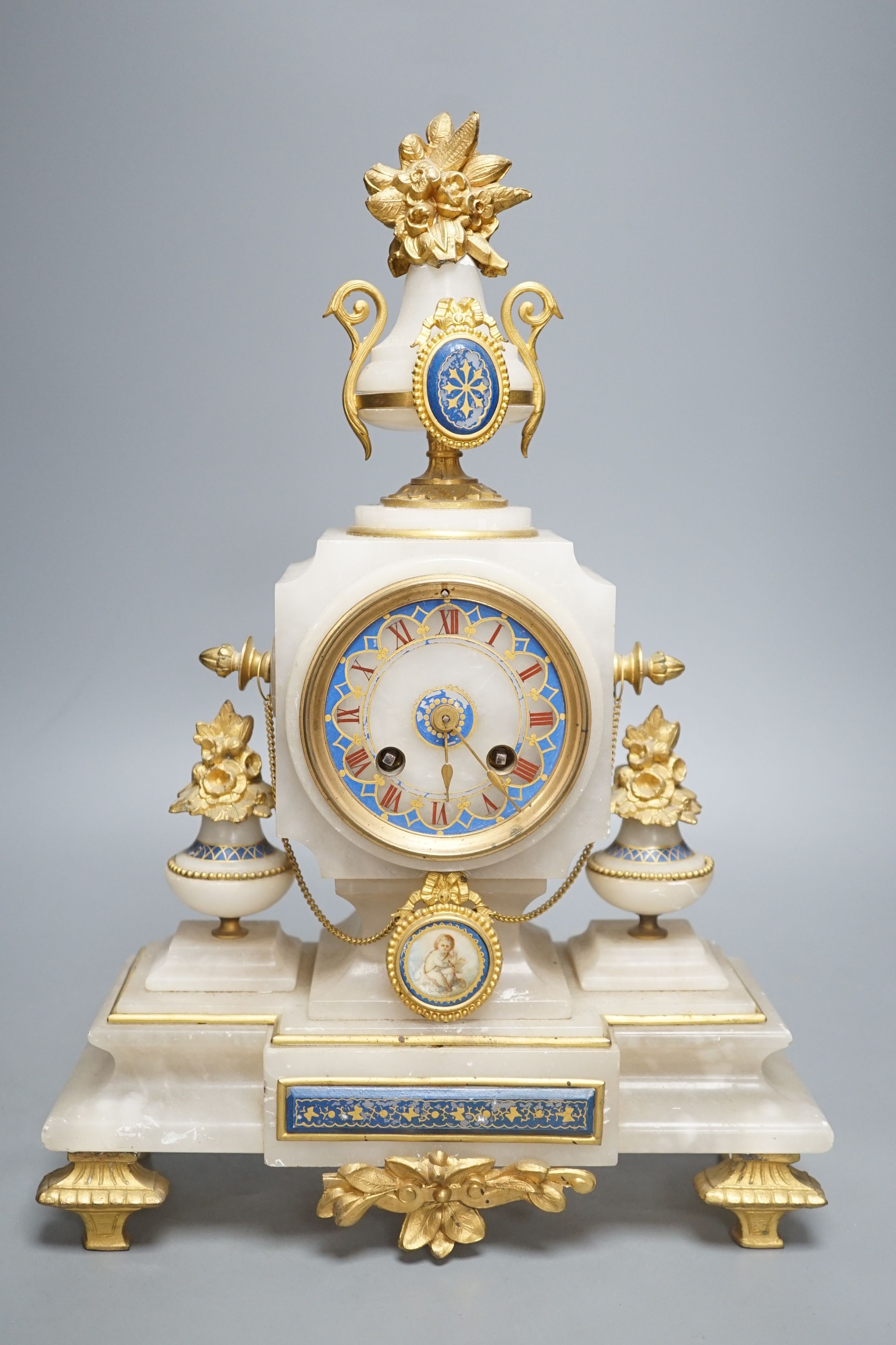 A late 19th century French alabaster and ormolu mounted mantel clock with key and pendulum - 39cm tall